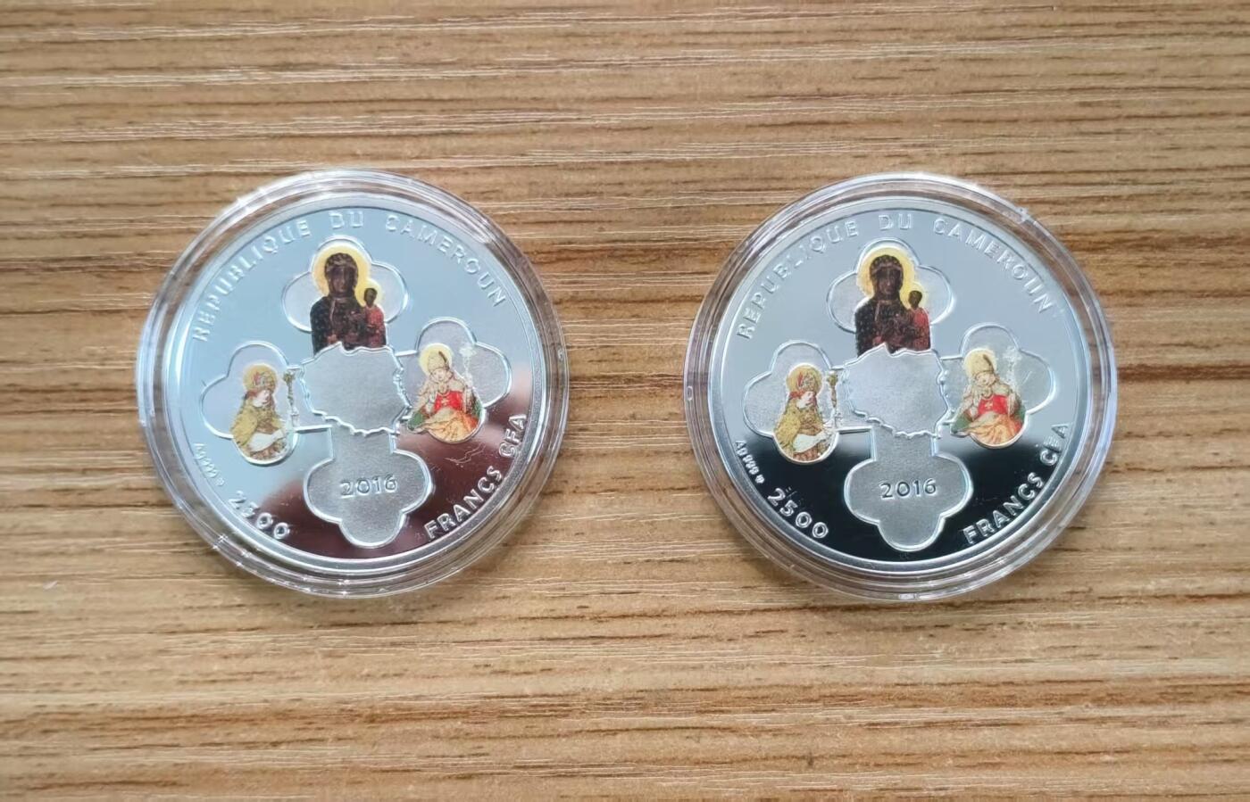 第184期拍卖 喀麦隆2016年，基督教世界青年节套装-世界青年日(波兰克拉科夫)+世界青年会议(波兰莱德尼察), 两枚完整全套装. 彩色精制纪念银币. 盒证全.(此套装共2枚,两枚币彩色面图案相同，非彩色面图案不同). 少见稀有漂亮银币套装. 实物超级精美漂亮. 国外售价315+美元.