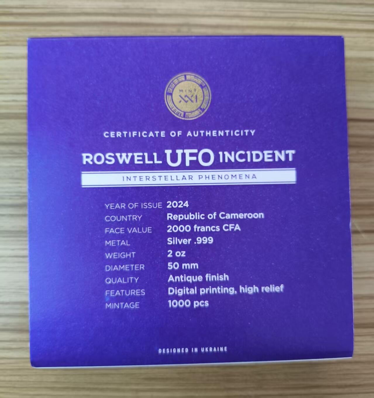 第184期拍卖 【龙头币】喀麦隆2024年, 星际现象(1)-罗斯威尔UFO事件，2盎司加大(直径达50mm), 金属蓝彩色、高浮雕、仿古、双面彩色纪念银币. 盒证全. (龙头币 新热门飞碟系列第一枚)，实物超漂亮质感动感. 国外售价436+美元