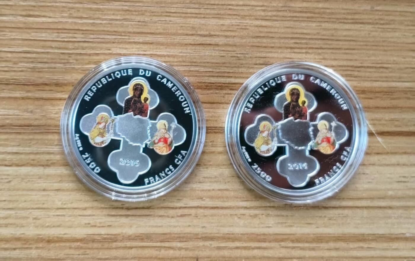 第184期拍卖 喀麦隆2016年，基督教世界青年节套装-世界青年日(波兰克拉科夫)+世界青年会议(波兰莱德尼察), 两枚完整全套装. 彩色精制纪念银币. 盒证全.(此套装共2枚,两枚币彩色面图案相同，非彩色面图案不同). 少见稀有漂亮银币套装. 实物超级精美漂亮. 国外售价315+美元.