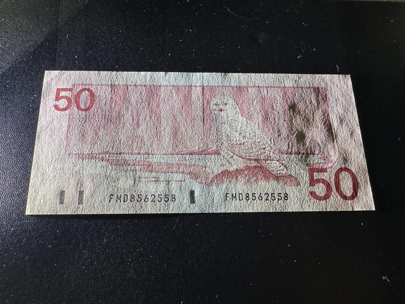 《外钞收藏家》第五百九十二期（精选场）（本平台长期征集拍品、欢迎藏友们联系合作） 1988年加拿大鸟版50加元 无47尾558 UNC- 有个黄斑