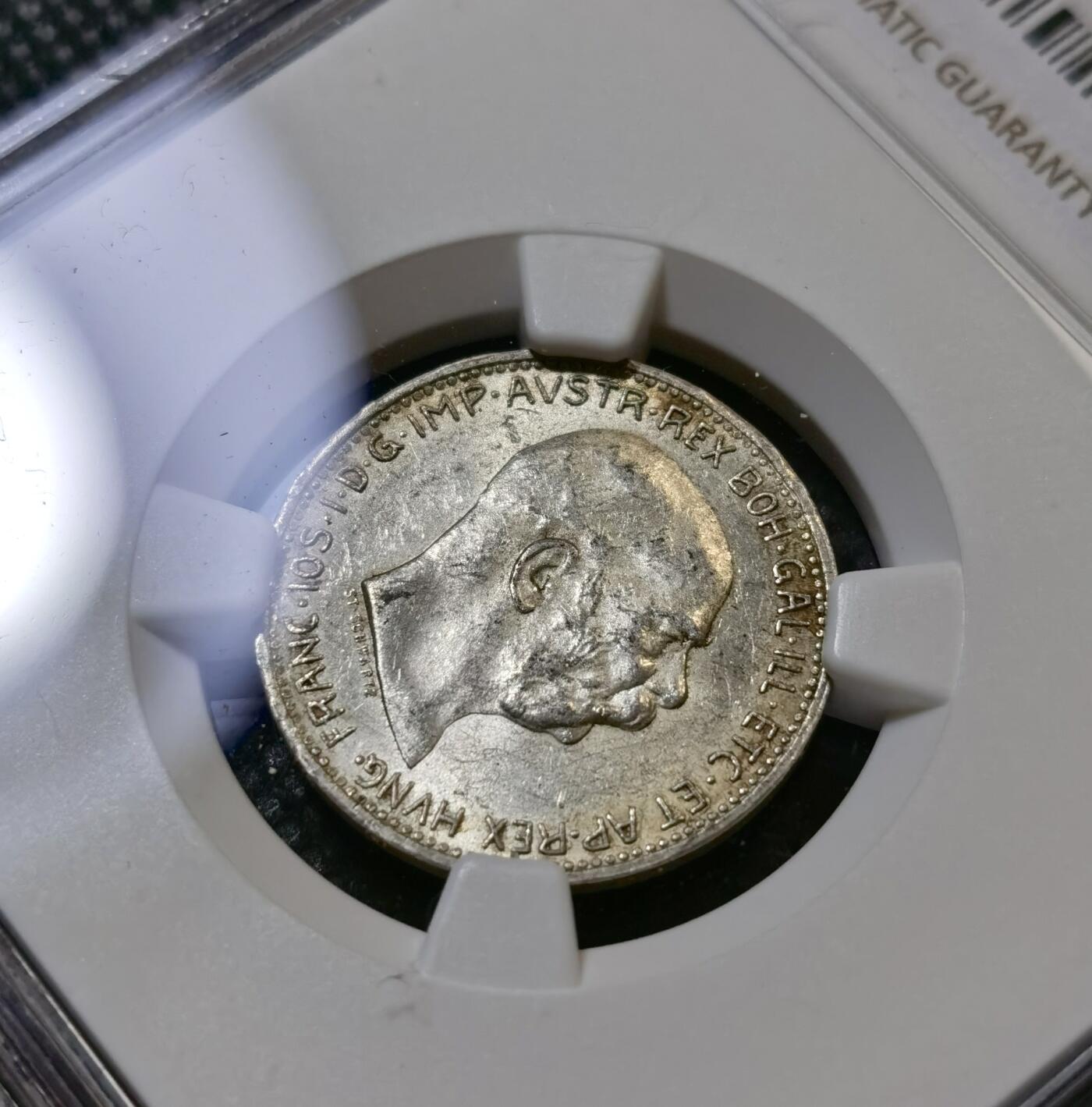 甄臻铺-世界币章拍卖（第43期）送拍享返佣金等优惠多多 NGC-UNCD 奥匈帝国一科罗娜银币，转光强烈，未流通好品相，看不出哪里有大问题