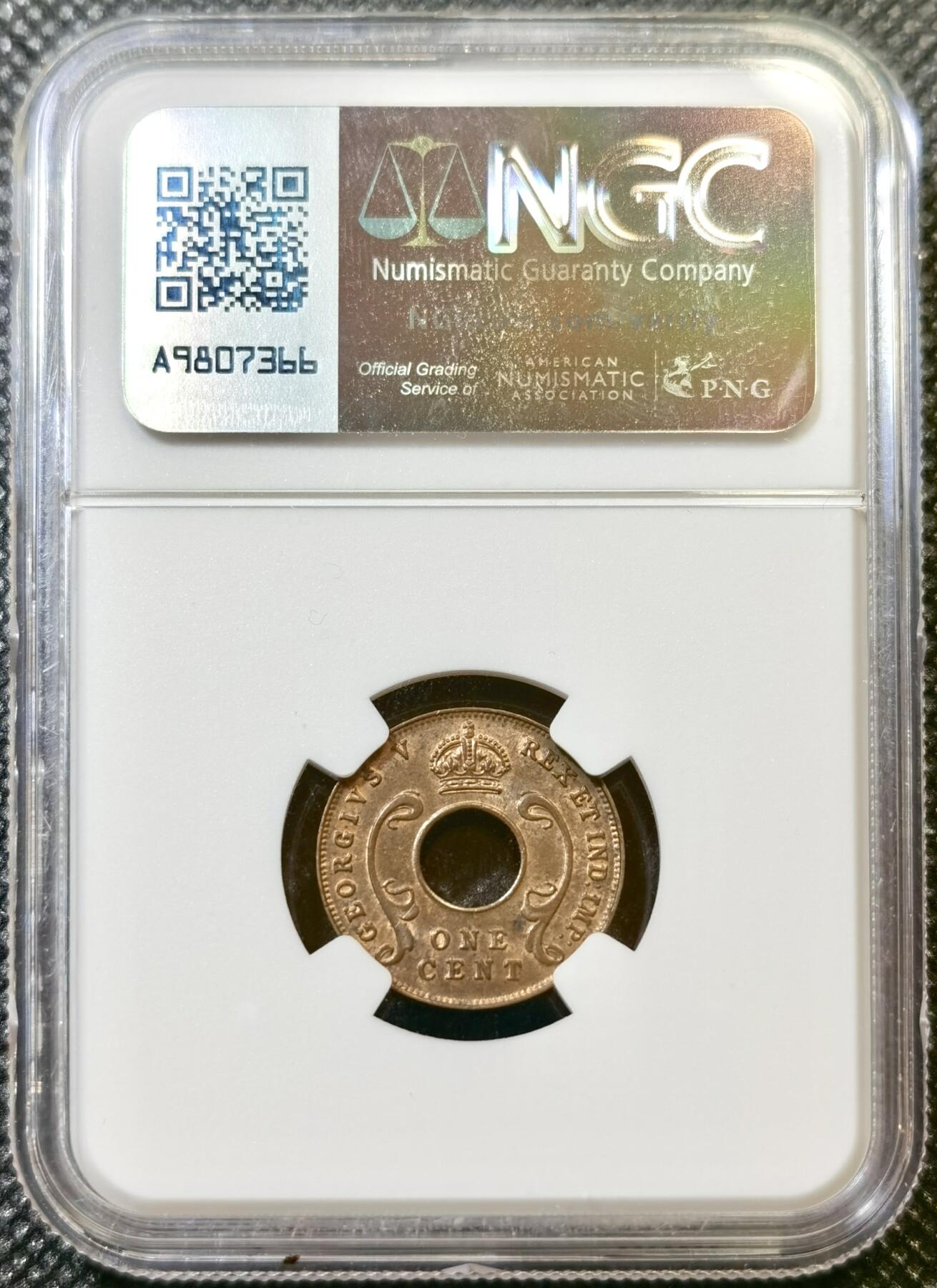 甄臻铺-世界币章拍卖（第43期）送拍享返佣金等优惠多多 NGC-MS63BN 英属东非中孔一分，有趣的中孔币，铜光满溢，状态非常好，经典殖民地品种