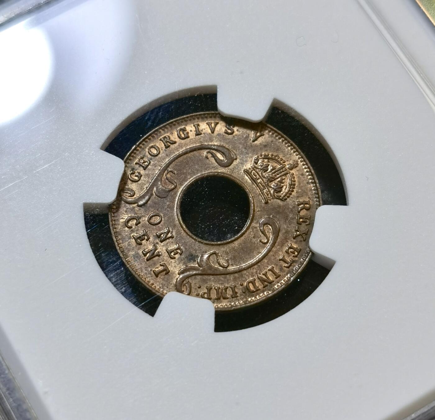 甄臻铺-世界币章拍卖（第43期）送拍享返佣金等优惠多多 NGC-MS63BN 英属东非中孔一分，有趣的中孔币，铜光满溢，状态非常好，经典殖民地品种