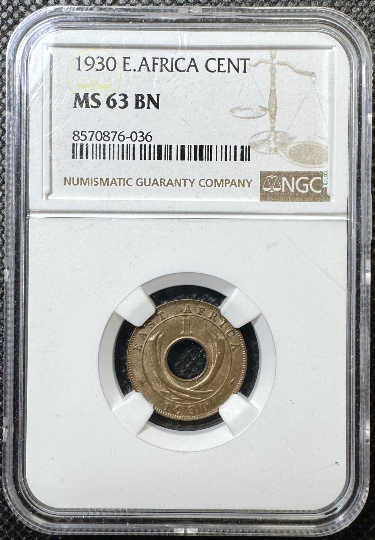 甄臻铺-世界币章拍卖（第43期）送拍享返佣金等优惠多多 NGC-MS63BN 英属东非中孔一分，有趣的中孔币，铜光满溢，状态非常好，经典殖民地品种