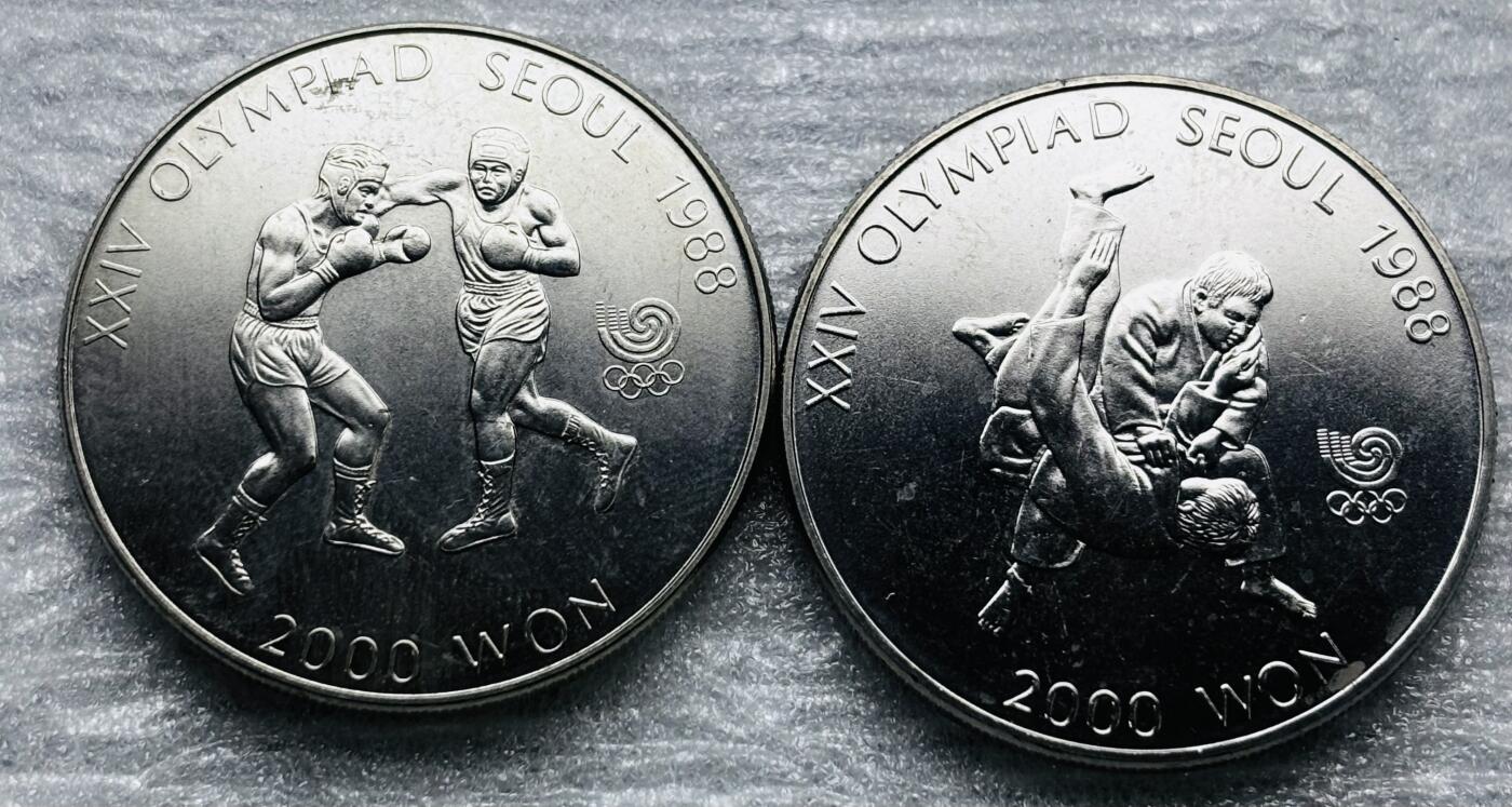 文馨钱币收藏第 284 场，【 长期接收代拍品】老藏家拍品南朝鲜李承晚时期货币，泰国大型纪念币，土耳其各时期及各国套币场 	韩国1986-87 年第二十四届夏季奥运会纪念币 拳击+柔道 2000 元 2 枚