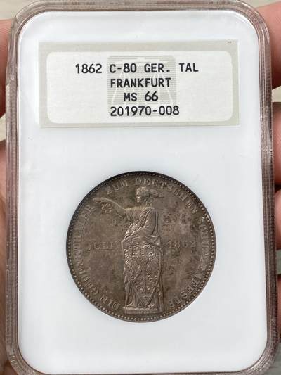 万国钱币拍卖第057期（万国冬季大拍） - NGC MS66 1862年德国法兰克福经典少女射击节1泰勒 厚重老五彩也无法掩盖的丝绸转光 实物上手状态惊艳  NGC老白盒顶级收藏品质（盒子左上磕碰）