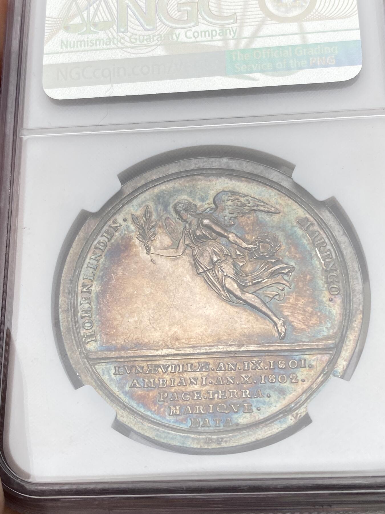 万国钱币拍卖第057期（万国冬季大拍） NGC MS61 1802年法国拿破仑一世纪念法国、英国、西班牙和巴塔维亚共和国之间的亚眠和平大银章 罕见银质火烧云七彩包浆极美收藏品质