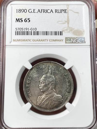 万国钱币拍卖第057期（万国冬季大拍） - NGC MS65 1890年德属东非威廉二世军装1卢比 经典东非小狮子 浓郁孔雀蓝彩顶级BU品质 无需换藏的典藏级品相