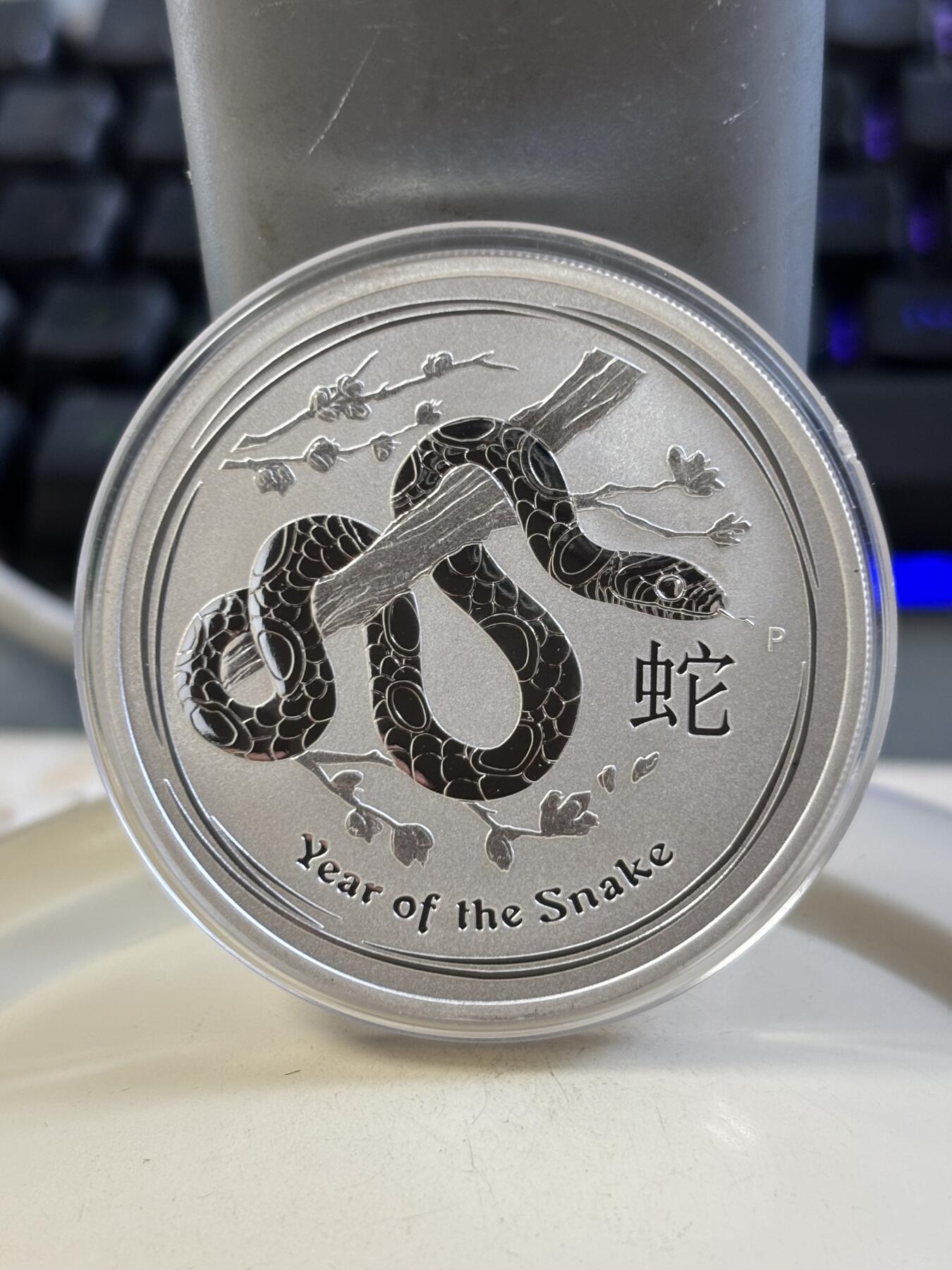 第185期拍卖 澳大利亚2013年十二生肖蛇1盎司纪念银币，999银，塑料盒有瑕疵