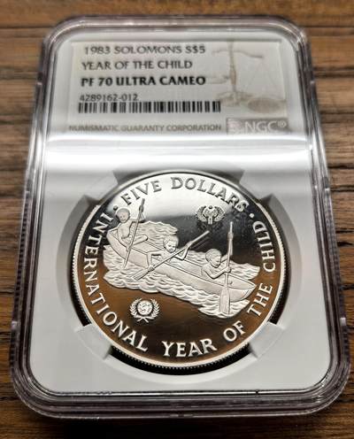 凡希社世界钱币微拍月度大拍（2025/12） - 1983所罗门群岛儿童年5元大银精铸NGC-PF70UC