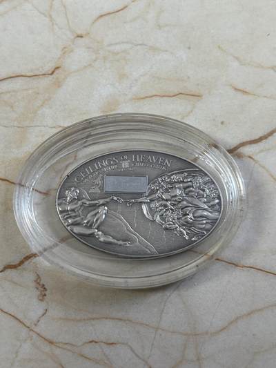 第185期拍卖 - 库克群岛2012年纳米芯片系列(1)–西斯廷教堂《创世纪》壁画椭圆形仿古纪念银币，999银，25克，发行999枚