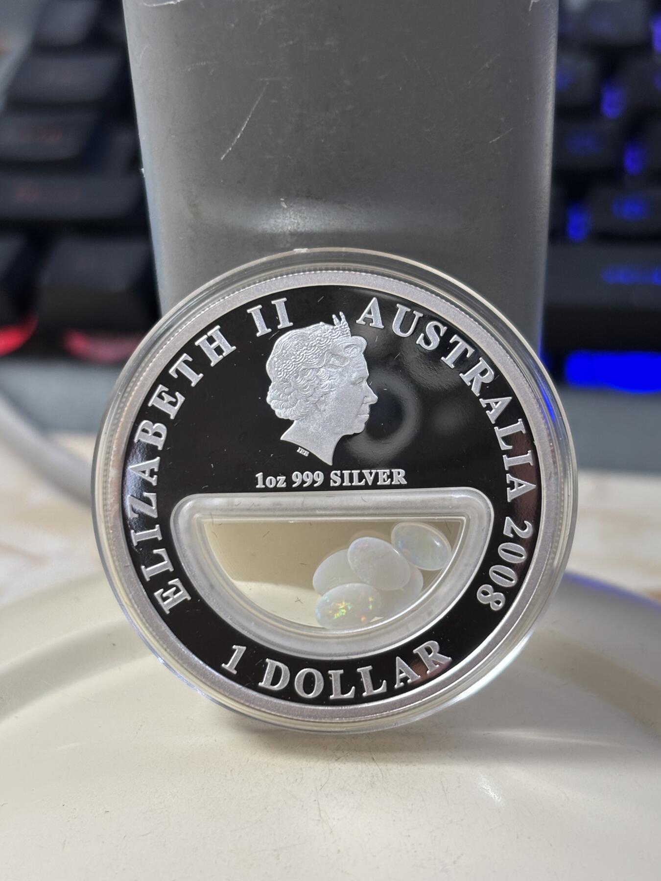 第185期拍卖 澳大利亚2008年澳洲宝藏系列中空镶嵌蛋白石银币，999银，发行7500枚，有氧化