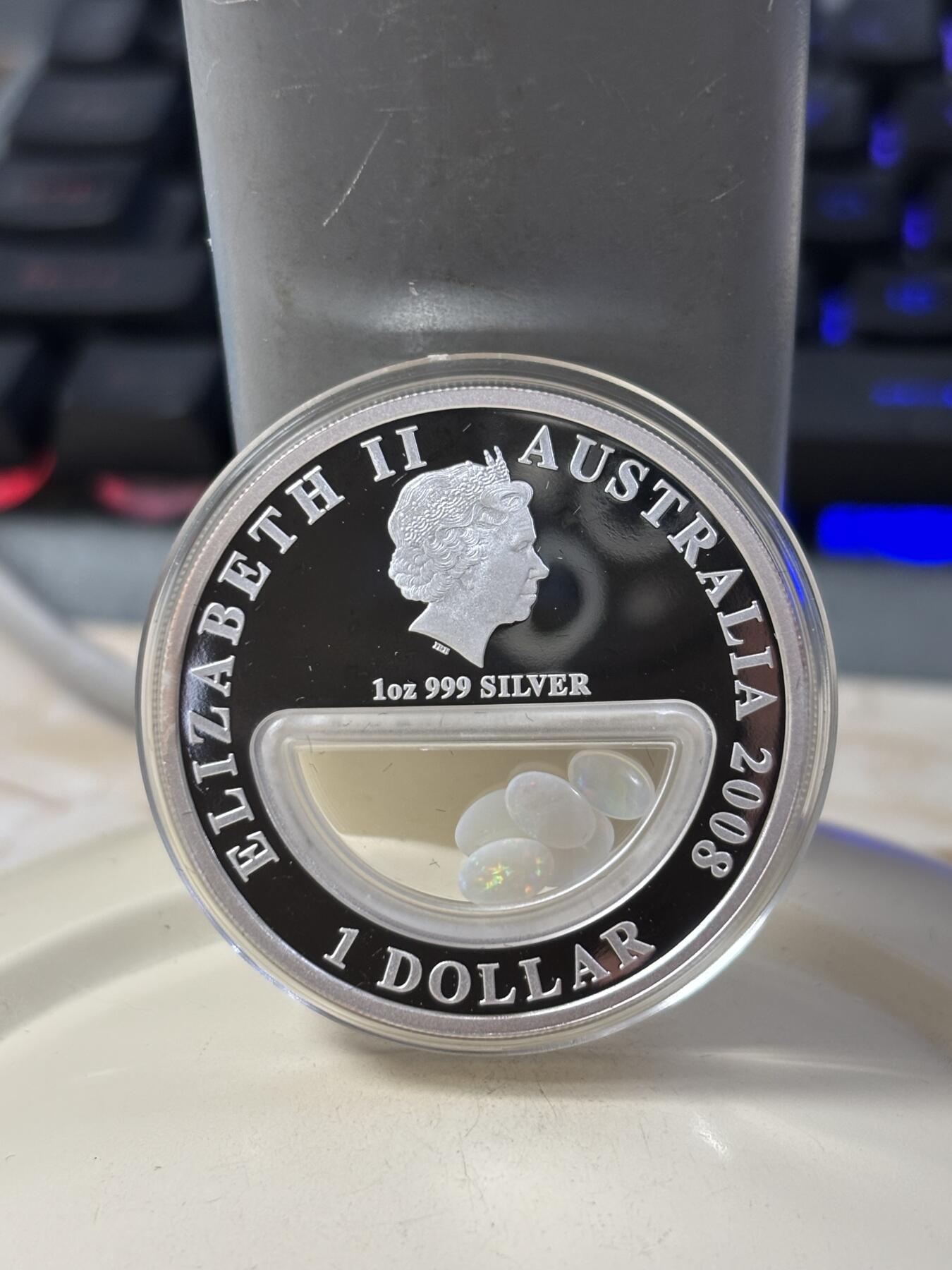 第185期拍卖 澳大利亚2008年澳洲宝藏系列中空镶嵌蛋白石银币，999银，发行7500枚，有氧化