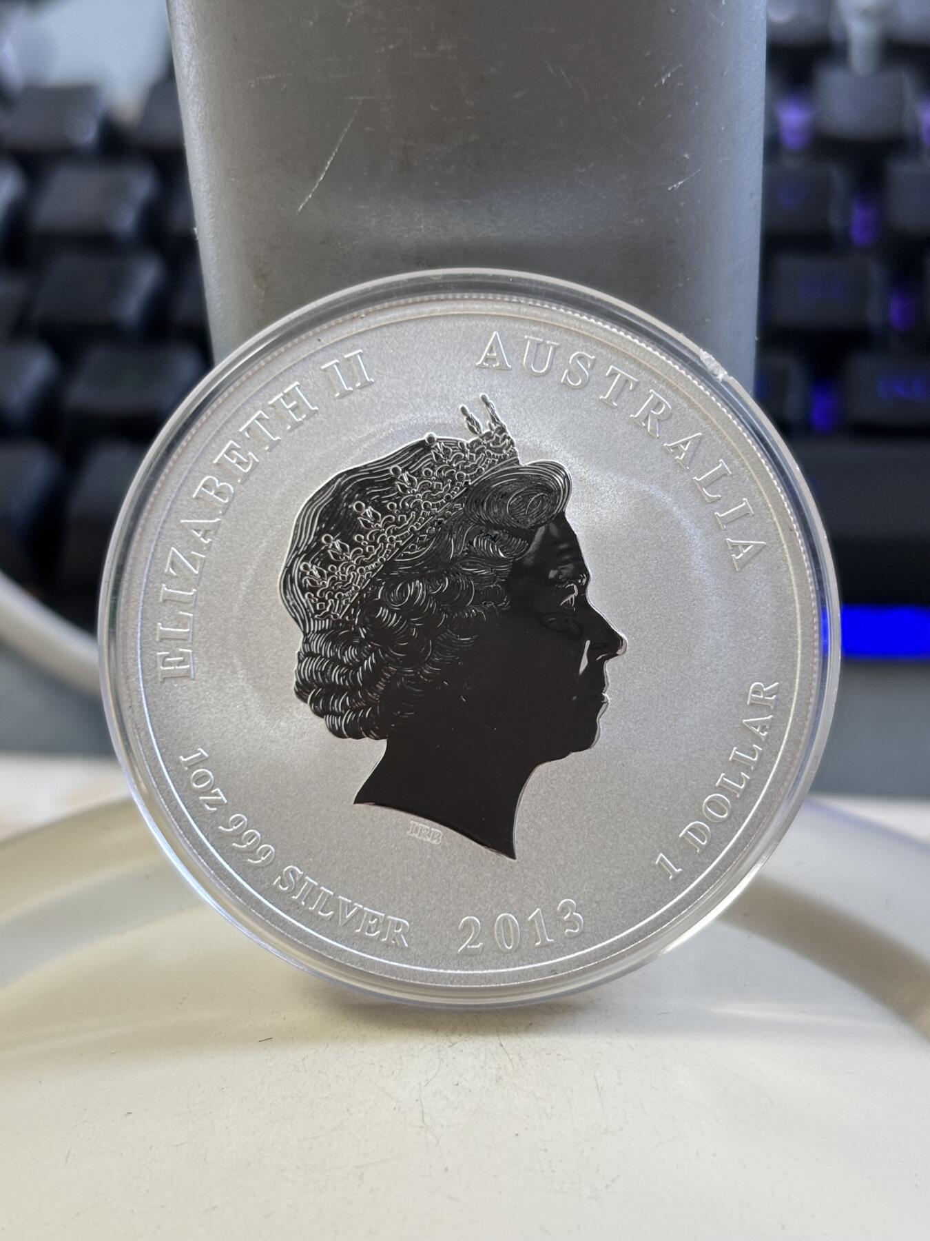 第185期拍卖 澳大利亚2013年十二生肖蛇1盎司纪念银币，999银，塑料盒有瑕疵