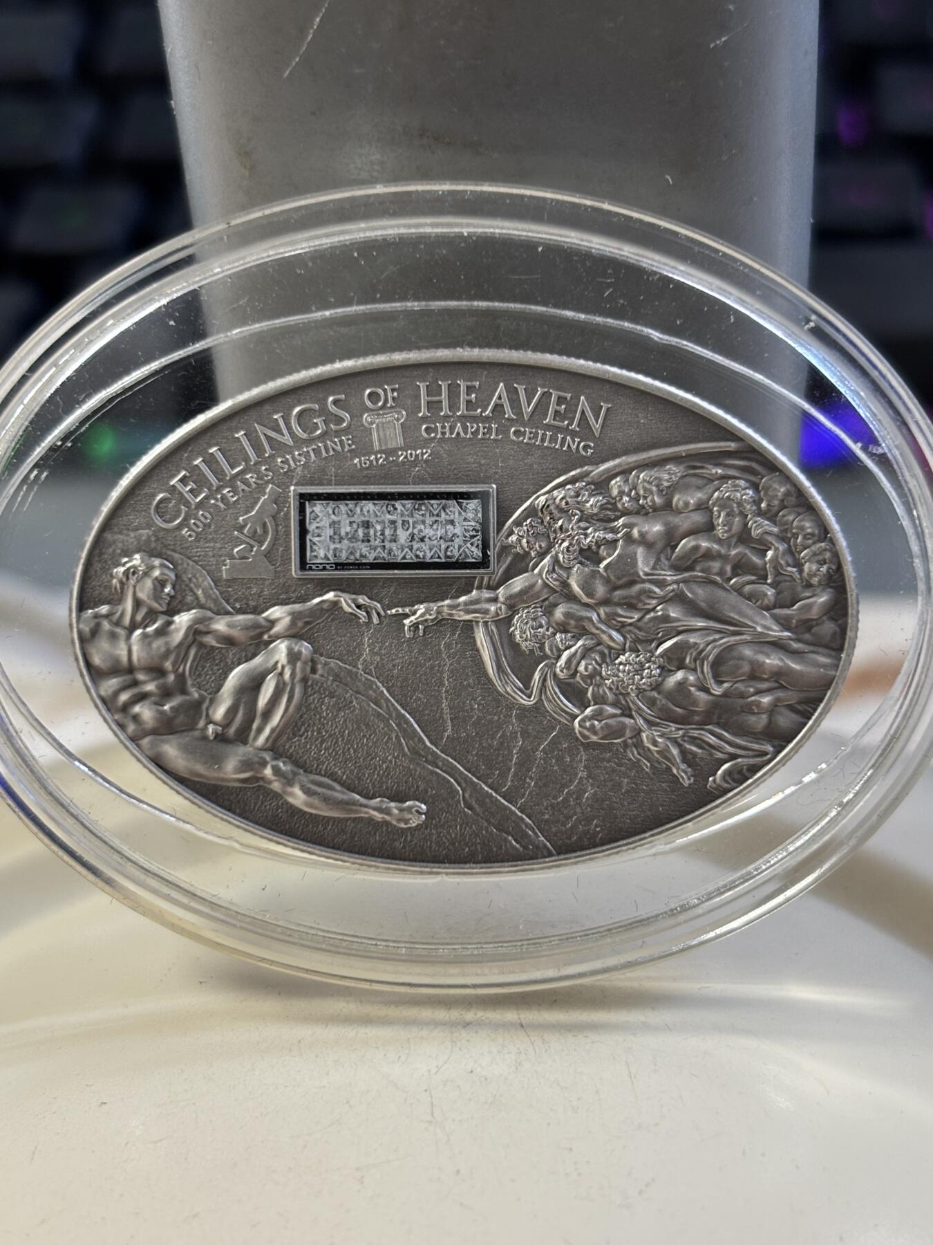 第185期拍卖 库克群岛2012年纳米芯片系列(1)–西斯廷教堂《创世纪》壁画椭圆形仿古纪念银币，999银，25克，发行999枚
