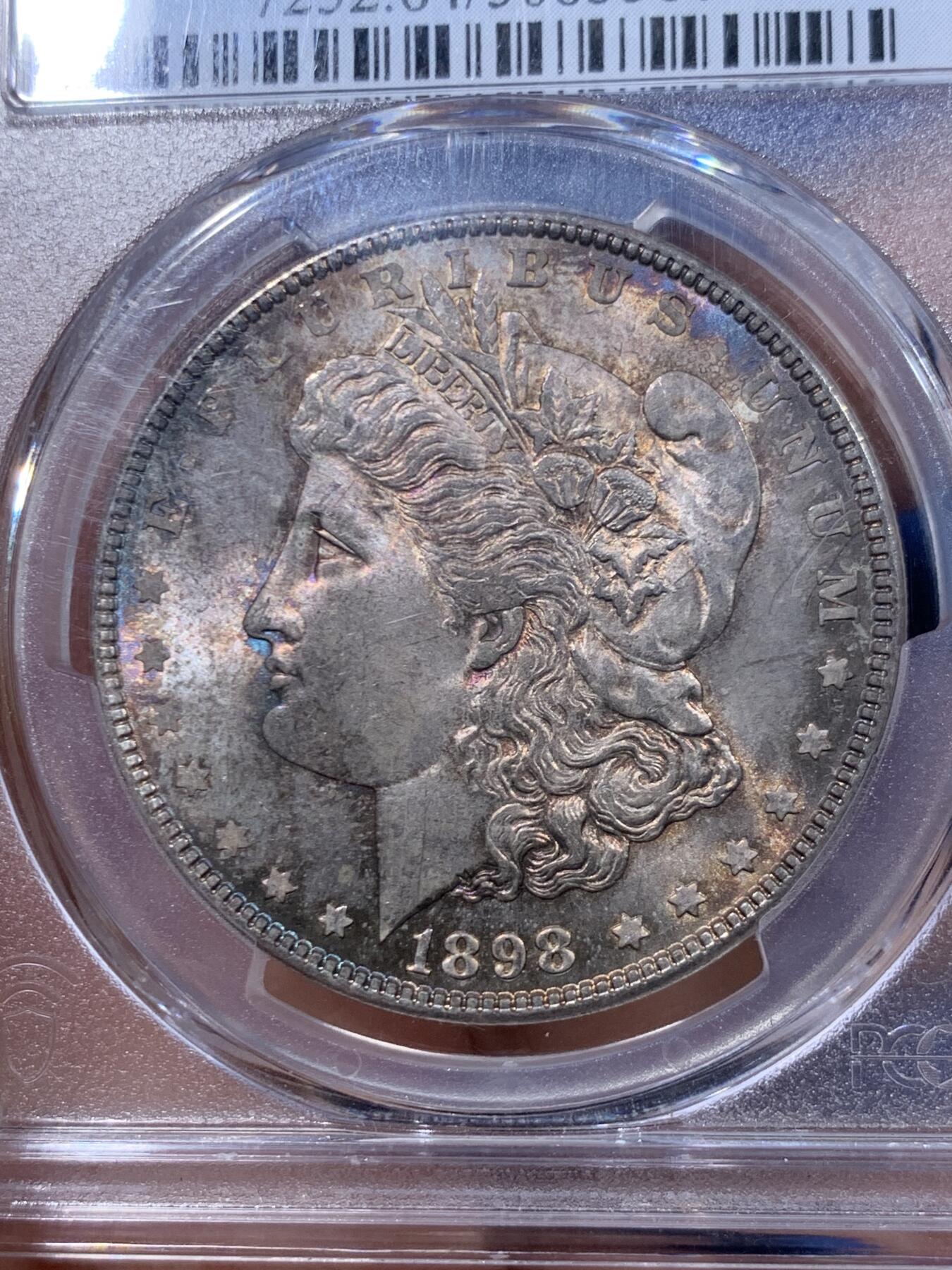 《竞宝斋》第447场 周日，周一，2场连拍 （全场包邮） PCGS MS64 美国 1898年 摩根银币 淡蓝紫色包浆，观感舒适养眼，少见