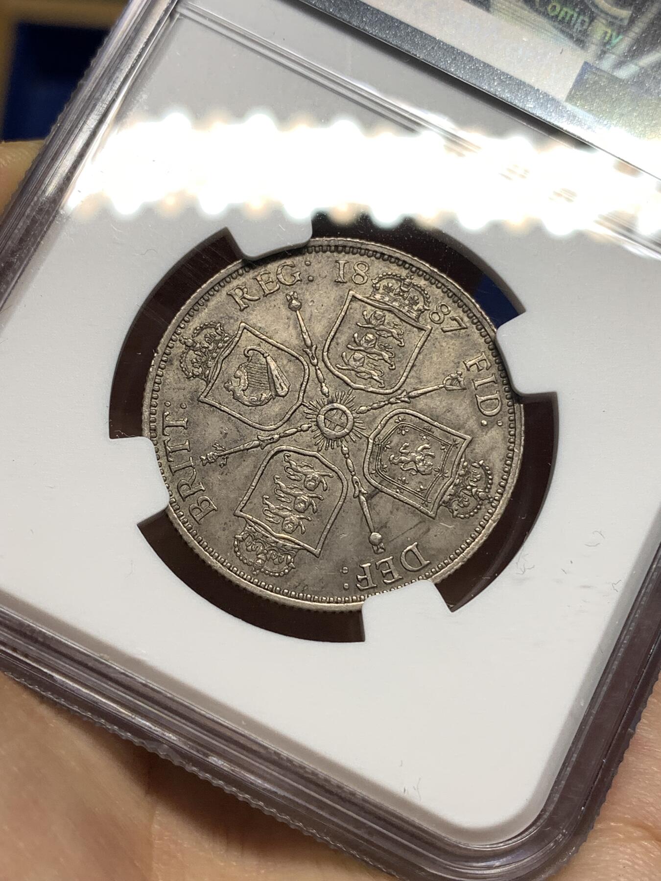 《竞宝斋》第447场 周日，周一，2场连拍 （全场包邮） NGC AU58 英国1887弗洛林银币，经典英伦包浆，略有低评。