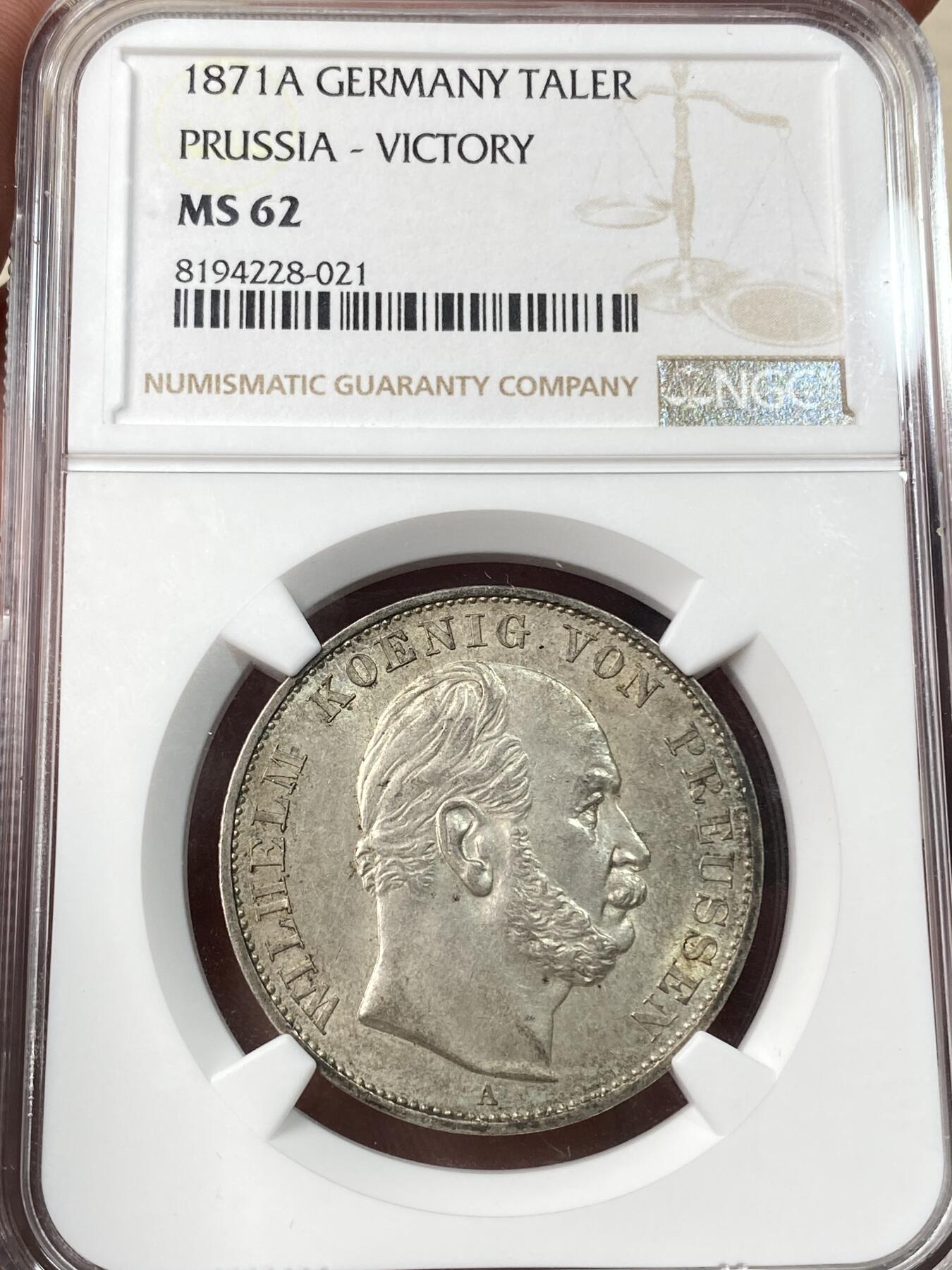 万国钱币拍卖第057期（万国冬季大拍） NGC MS62 1871年普鲁士威廉一世普法胜利泰勒 经典女武神 高浮雕质感五官清晰 银霜转光环月牙彩非常漂亮