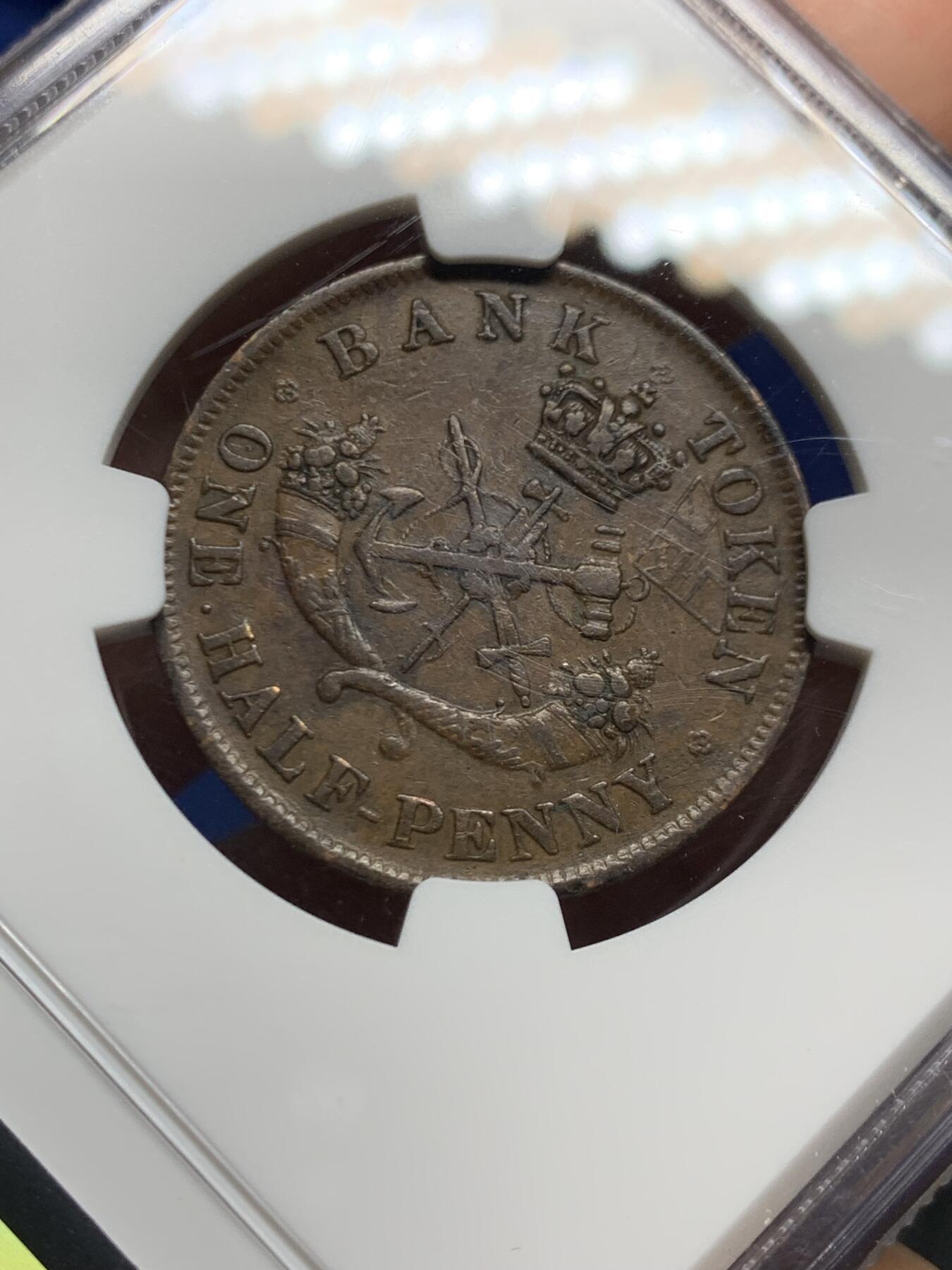 《竞宝斋》第447场 周日，周一，2场连拍 （全场包邮） NGC AU55BN 上加拿大1857半便士银行token，经典马剑设计，这个品种上AU都非常难，铜币爱好者必选