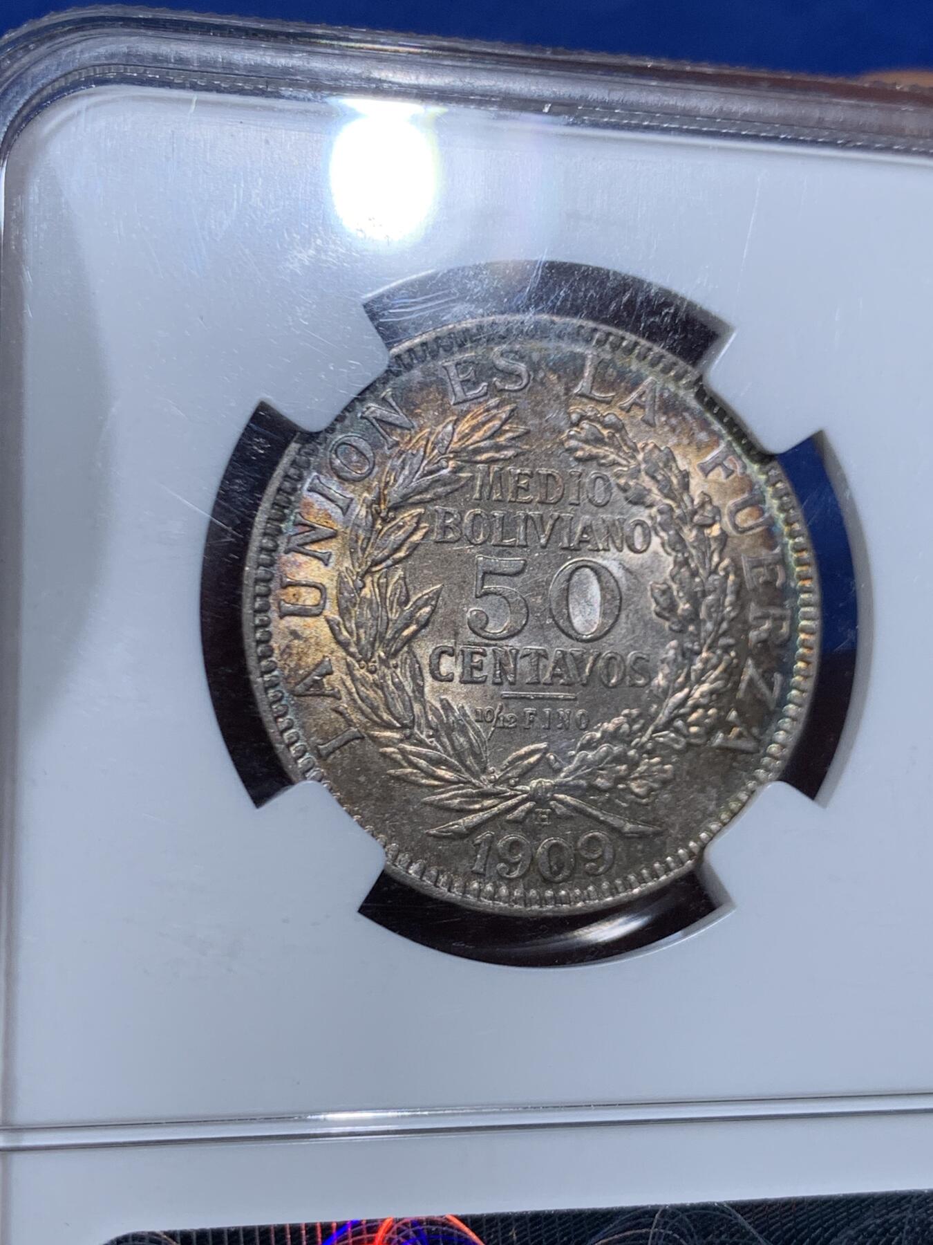 《竞宝斋》第447场 周日，周一，2场连拍 （全场包邮） NGC MS63 玻利维亚 1909年 50分 银币 双面五彩包浆 非常有意思的南美洲设计