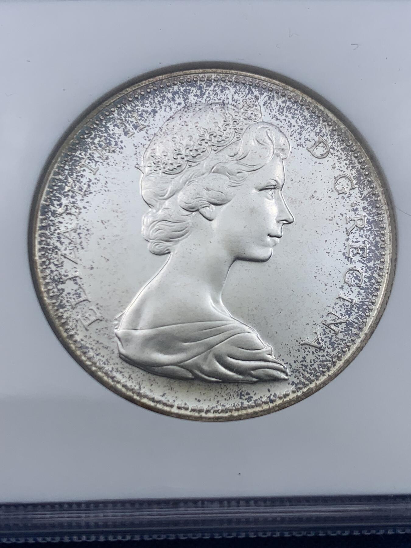 《竞宝斋》第447场 周日，周一，2场连拍 （全场包邮） NGC PF65 加拿大1967年伊丽莎白二世1元大雁银币，正面环彩满天星， NGC老盒子，上手观感更佳