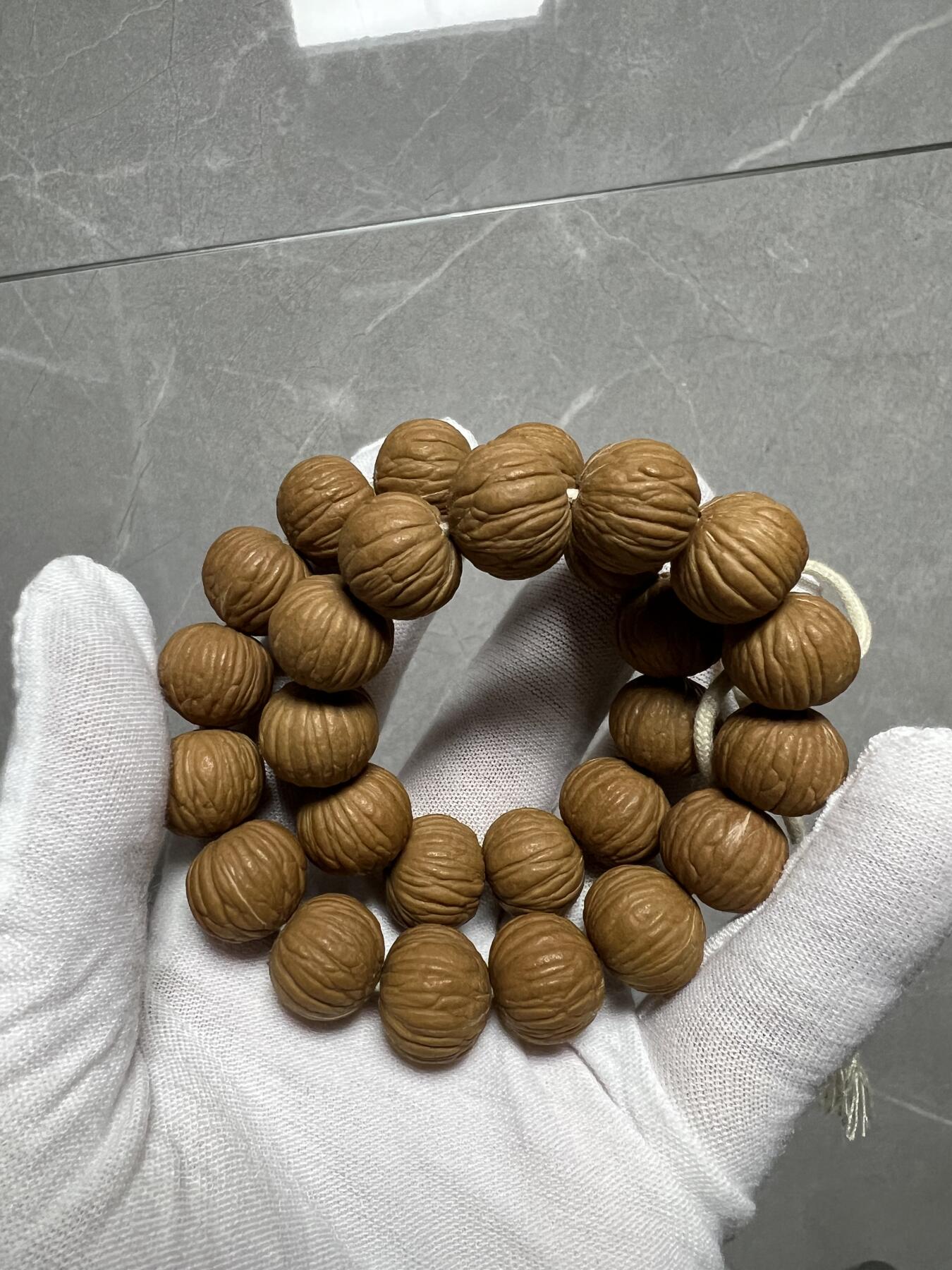 零元拍：W1 猴头凤羽14.5MM原生态手串 手持