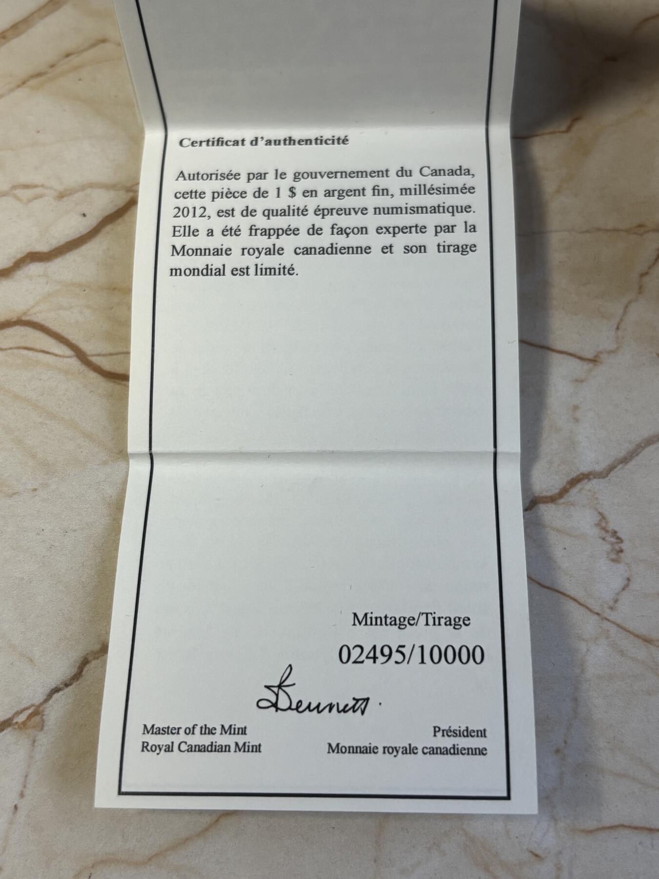 第186期拍卖 加拿大2012彩印潜水鸟标志性加元发行25周年1盎司银币，9999银，发行10000枚