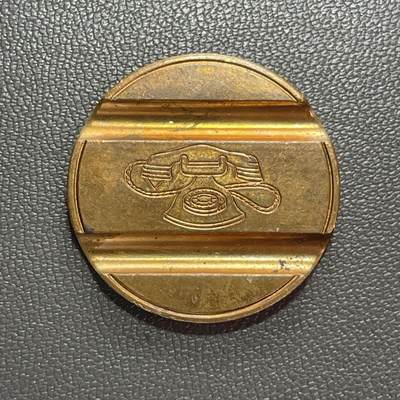 回流1222 - 未使用 意大利1975年6月发行的黄铜制电话代币（Gettone Telefonico），编号7506，是20世纪意大利公共电话的专用支付代币