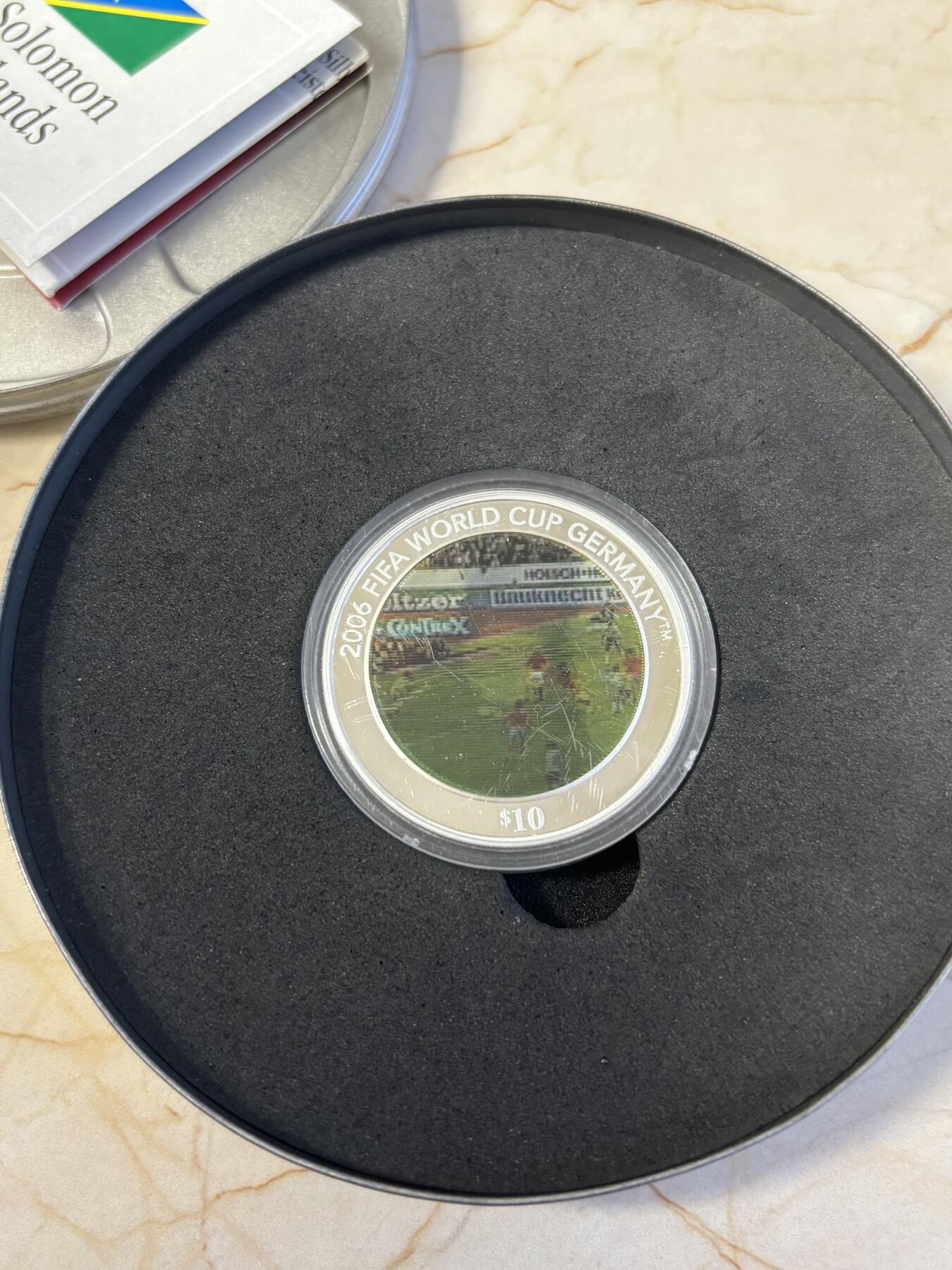 第186期拍卖 所罗门2005年发行2006年世界杯幻彩1盎司纪念银币带盒证书，999银，