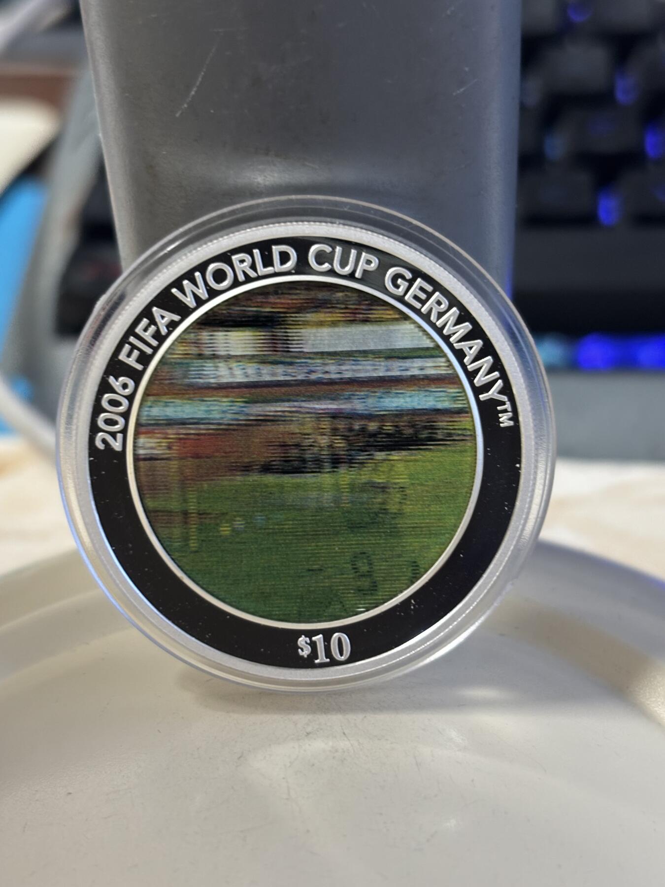 第186期拍卖 所罗门2005年发行2006年世界杯幻彩1盎司纪念银币带盒证书，999银，