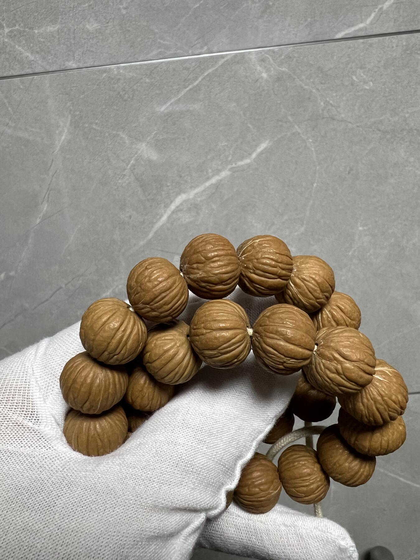 零元拍：W1 猴头凤羽14.5MM原生态手串 手持