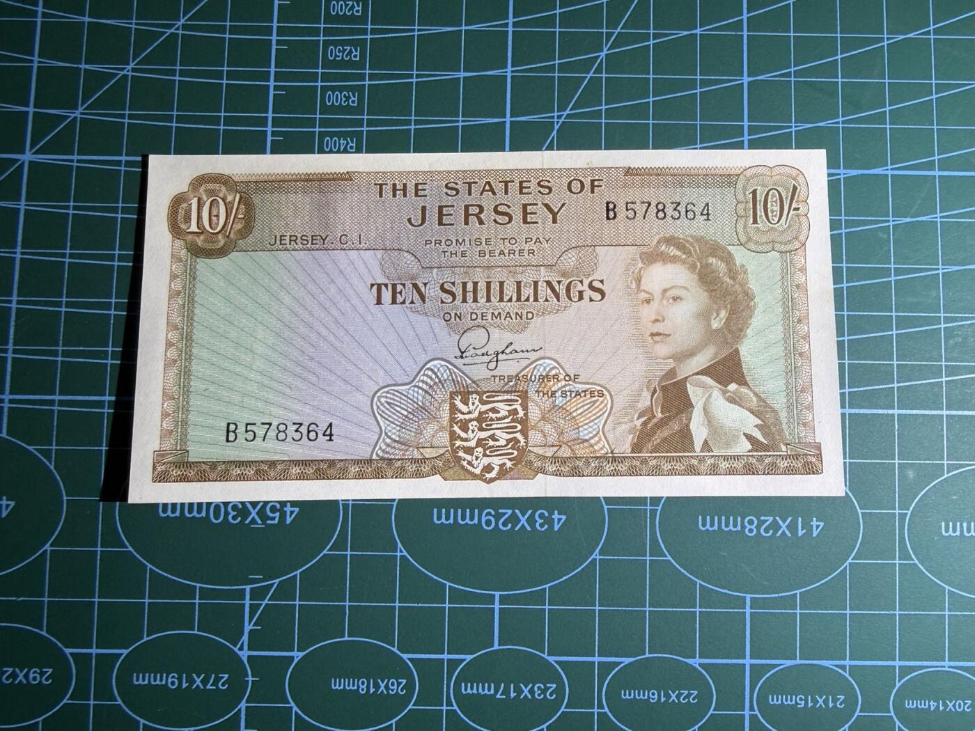 【炜奕收藏】，第五十三期 1963年泽西10先令，UNC品相，乱龙号