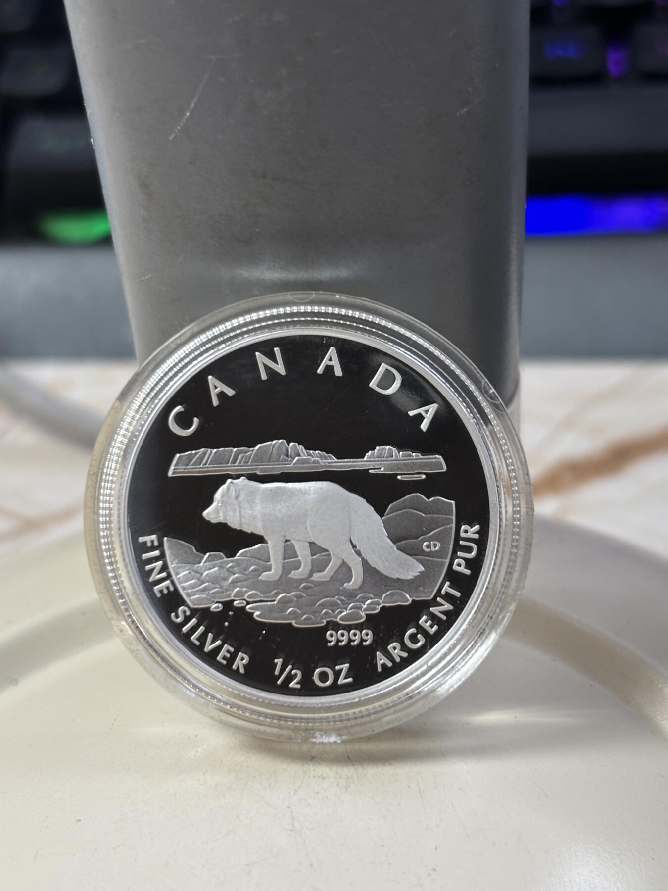 第185期拍卖 加拿大2004年2/3/4/5元精制银币套 北极狐 1/10，1/4，1/2，1盎司9999银 发行量：2万 盒证全