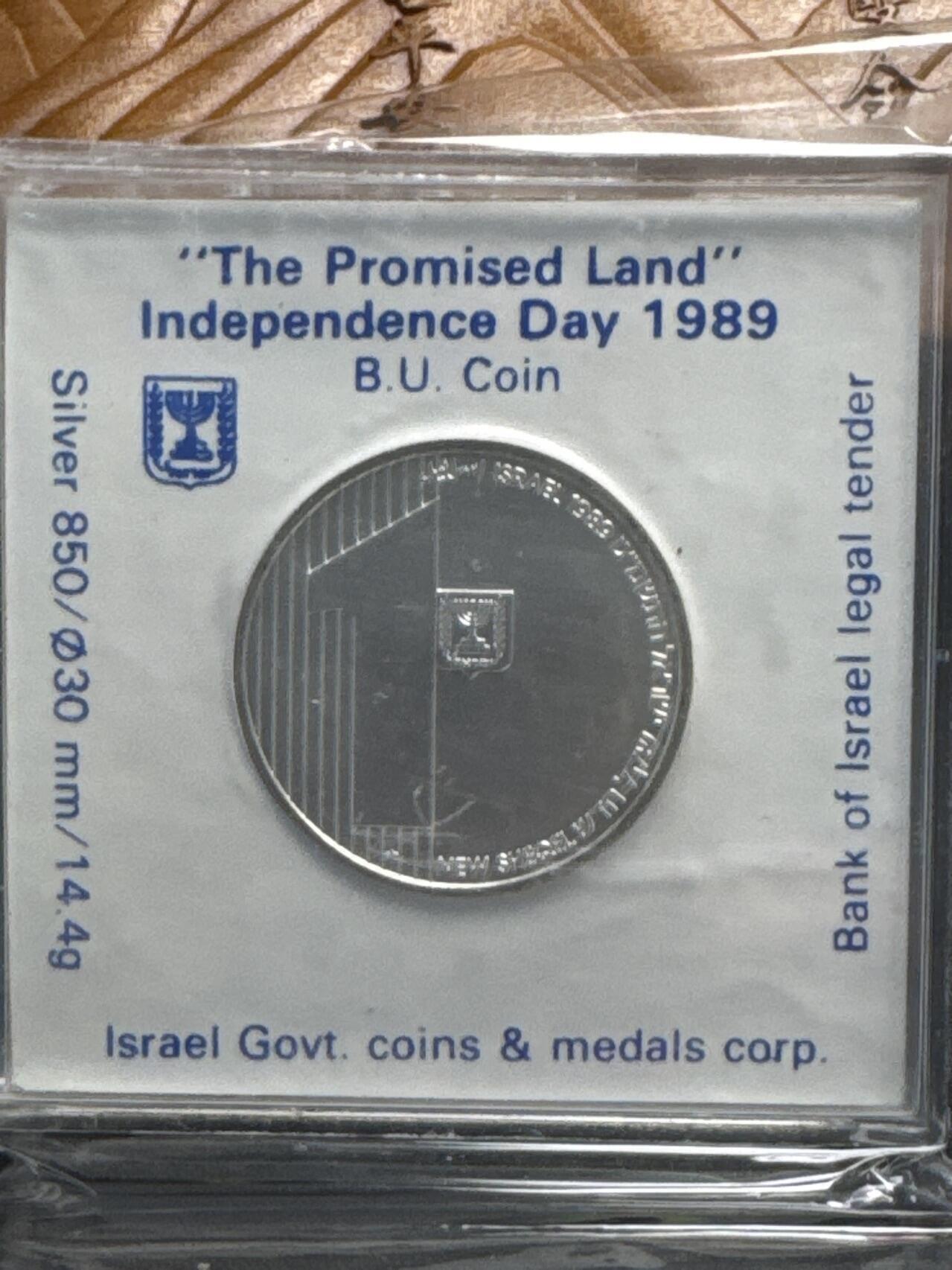 ❤️【币观天下】❤️ 第335期钱币拍卖- 2025.12.19周五晚上6点半场-长期征集拍品 原厂方盒盒证一体克劳斯获奖币同款以色列1989年“应许之地”“独立日”面值1新谢克尔纪念银币850银14.4克直径30毫米