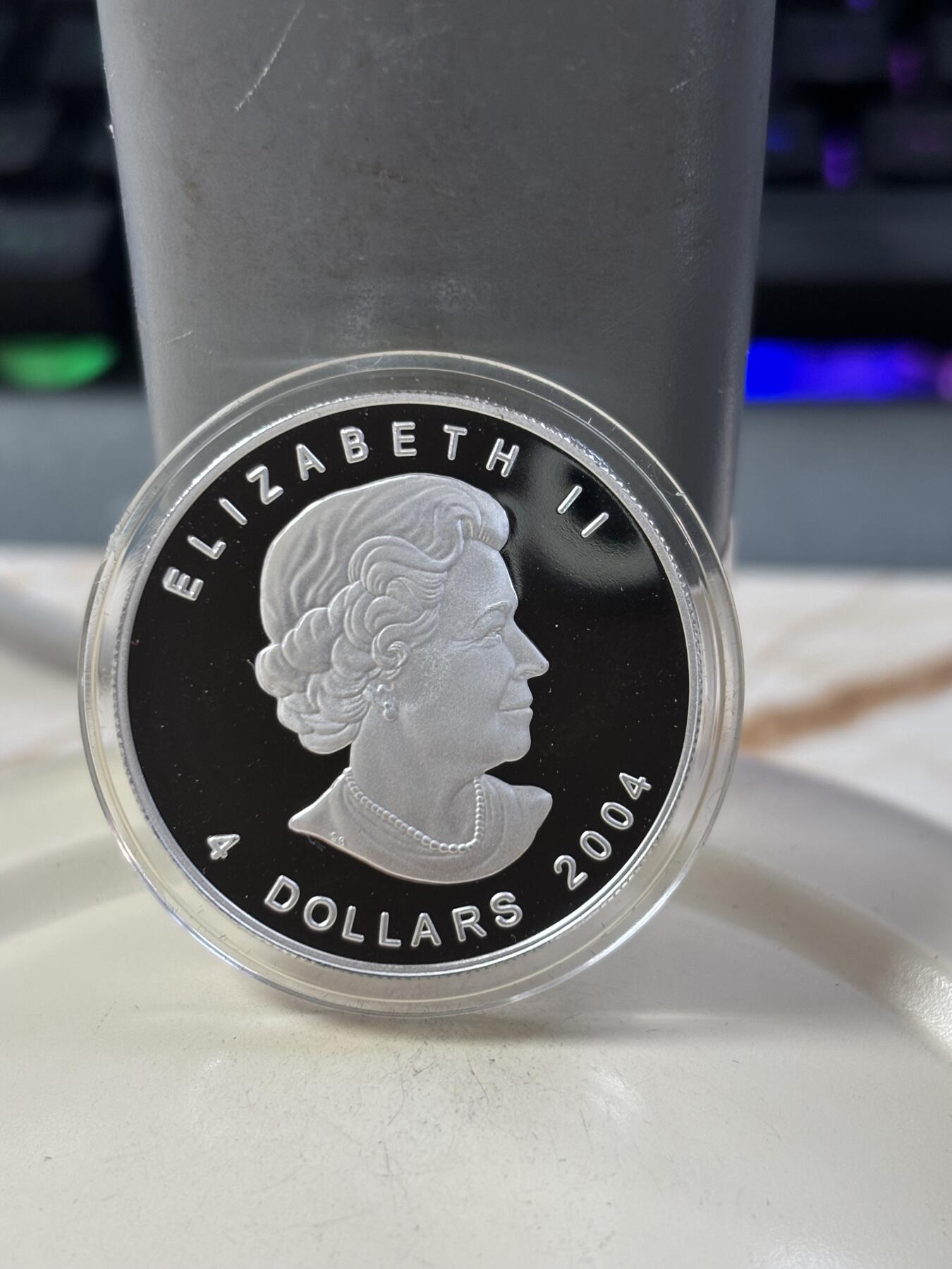 第185期拍卖 加拿大2004年2/3/4/5元精制银币套 北极狐 1/10，1/4，1/2，1盎司9999银 发行量：2万 盒证全