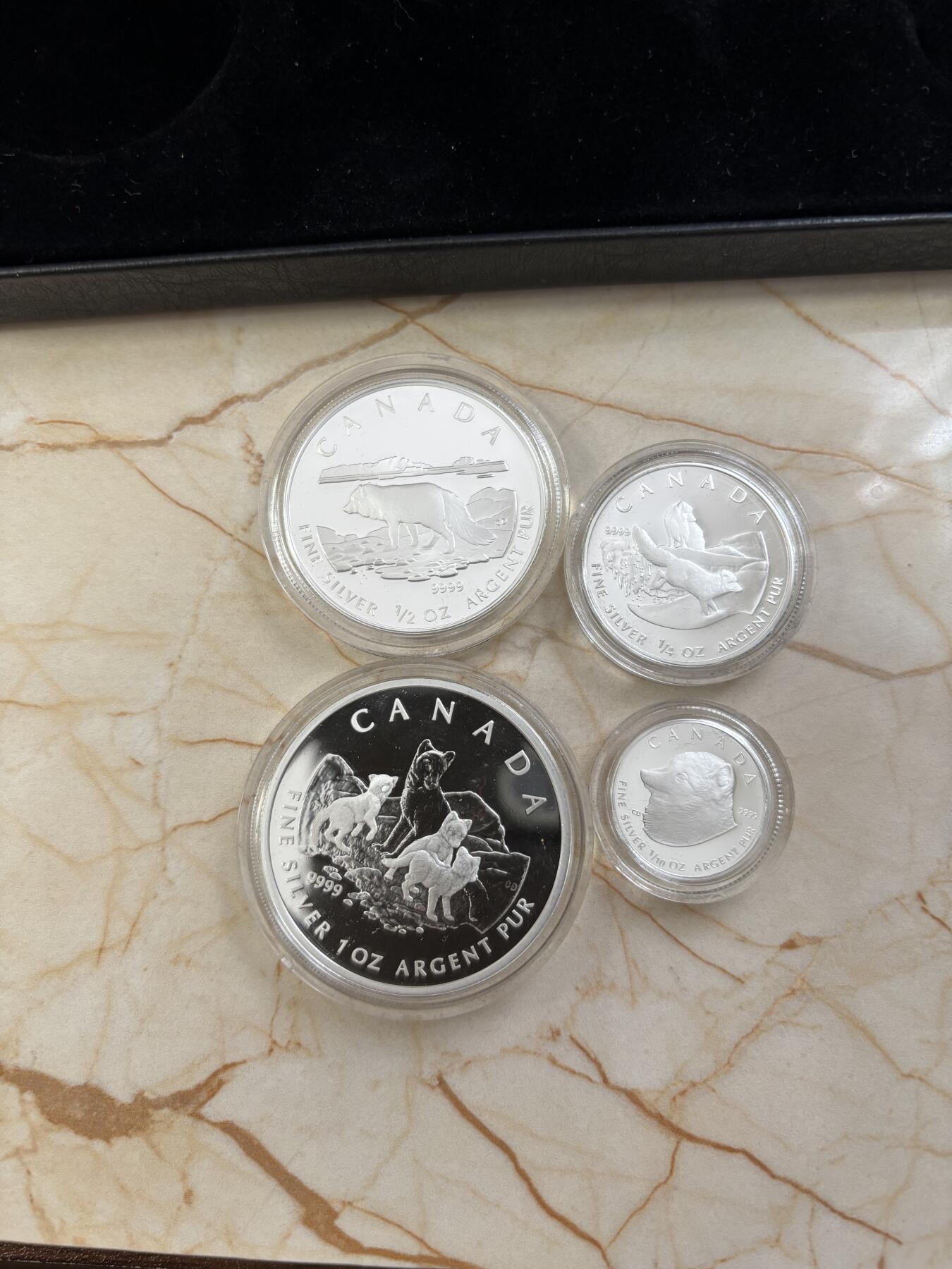 第185期拍卖 加拿大2004年2/3/4/5元精制银币套 北极狐 1/10，1/4，1/2，1盎司9999银 发行量：2万 盒证全