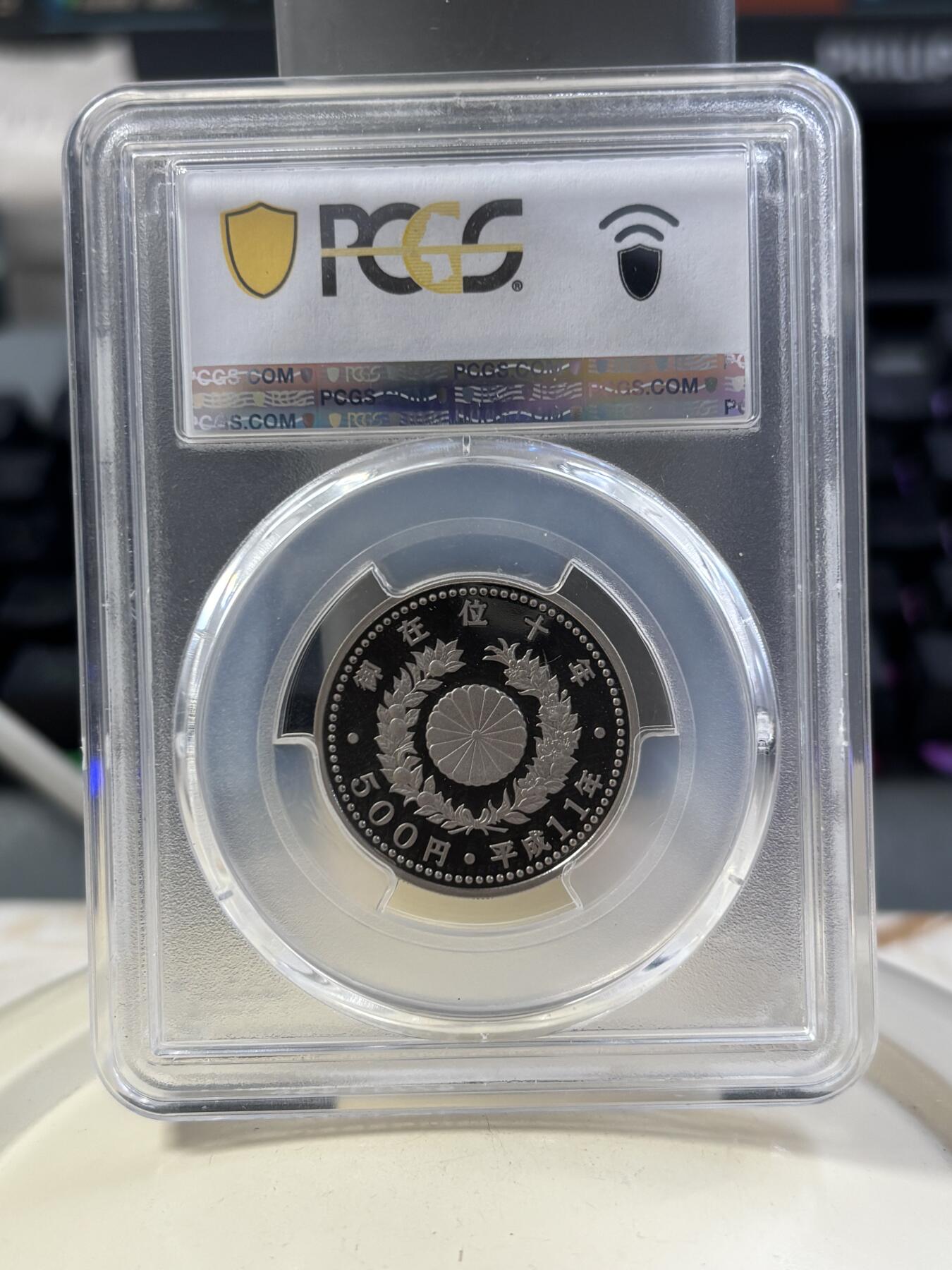 第185期拍卖 日本1999年500元精制纪念币 平成登基十年 发行量：10万 冠军分 PCGS PR70DCAM