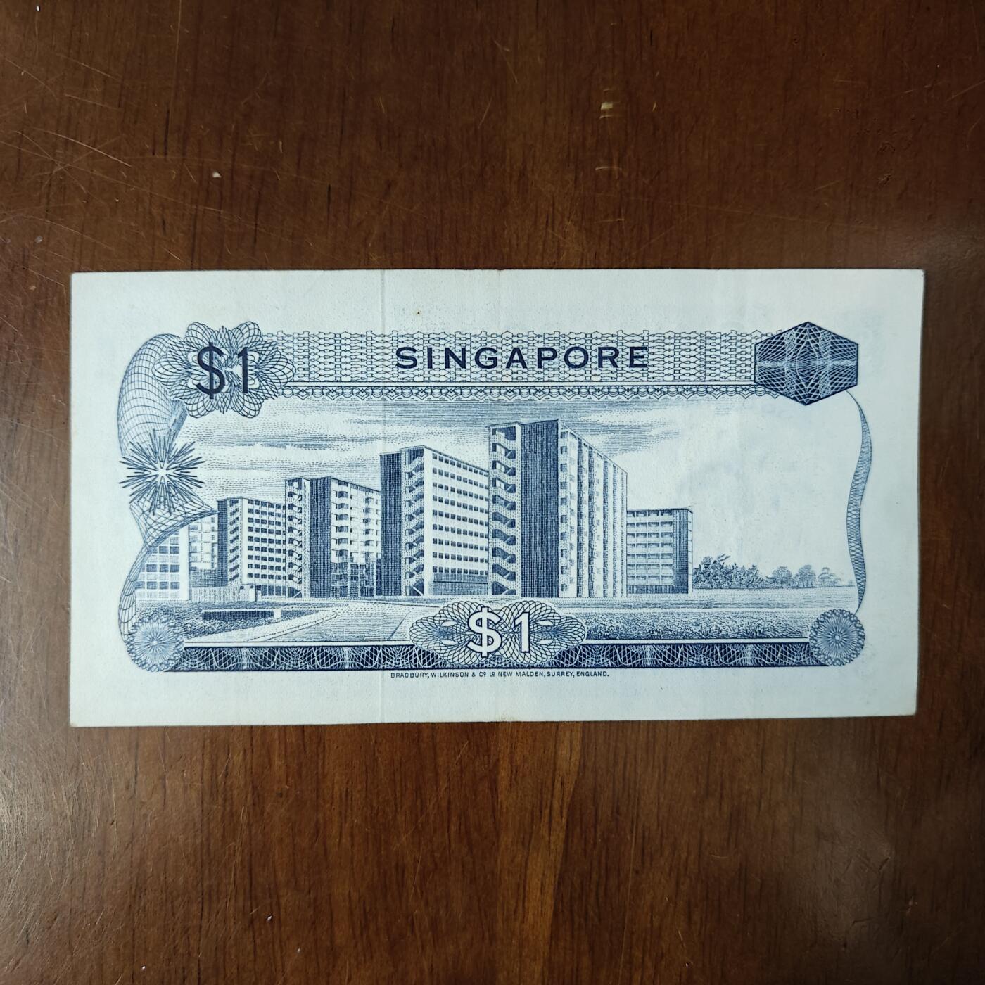 第一版新加坡1元胡姬花版 新加坡花版1圆流通好品原票原图片
