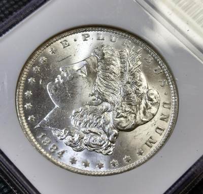 甄臻铺-世界币章拍卖（第44期）精品场拍品征集中，送拍享返佣金等优惠多多 NGC-MS64 1884年O版美国摩根，币面干净整洁，小白盒手感好