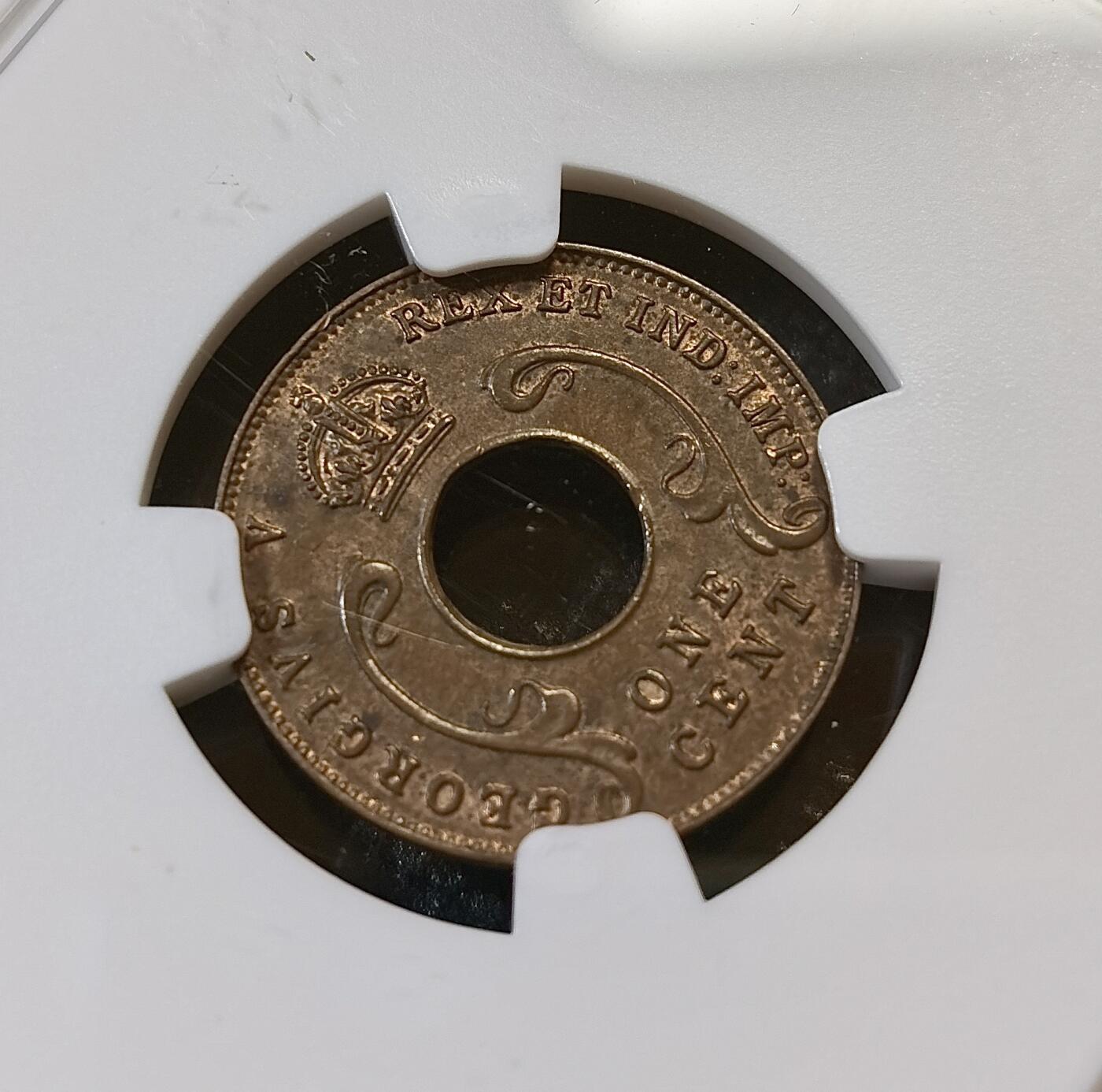 甄臻铺-世界币章拍卖（第44期）精品场拍品征集中，送拍享返佣金等优惠多多 NGC-MS62BN 英属东非中孔一分，有趣的中孔币，铜光满溢，状态非常好，经典殖民地品种