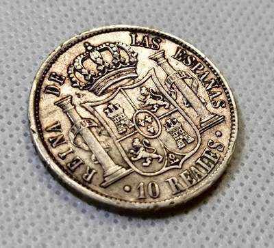 甄臻铺-世界币章拍卖（第44期）精品场拍品征集中，送拍享返佣金等优惠多多 西班牙伊莎贝尔二世10R(瑞斯)猪头妹  珍惜品种，包浆细节很好，几乎没有什么磨损，某鱼通货900+挂牌   1852年，29.5mm  13.1g  90Ag，细节见图