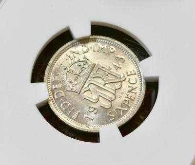 甄臻铺-世界币章拍卖（第44期）精品场拍品征集中，送拍享返佣金等优惠多多 NGC-MS64 英国1943年乔治六世六便士银币，BU卷拆，爱情幸运币寓意好，可藏状态