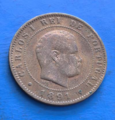 外国优质老铜币高银银币，周六九点倒数截拍，满百包邮，持续收拍 - 葡萄牙1891年10 瑞斯（Reis）铜币，正面是国王卡洛斯一世（Carlos I）肖像，见证 19 世纪末葡萄牙历史；设计上，橄榄枝与月桂枝叶环绕面值，具古典美感；作为百年老币，存世量随时间减少，对研究葡萄牙货币史、君主制时期文化有实物价值，是钱币收藏中连通历史的小缩影 。