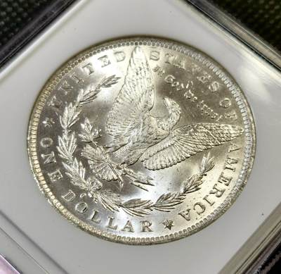 甄臻铺-世界币章拍卖（第44期）精品场拍品征集中，送拍享返佣金等优惠多多 NGC-MS64 1884年O版美国摩根，币面干净整洁，小白盒手感好