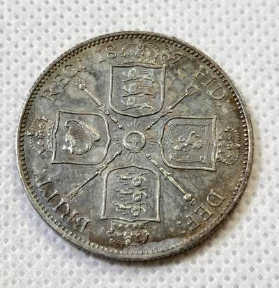 甄臻铺-世界币章拍卖（第44期）精品场拍品征集中，送拍享返佣金等优惠多多 UNC品相英国1887福林银币，原光带彩好状态，现在好品相的裸币不太好找了，细节见图