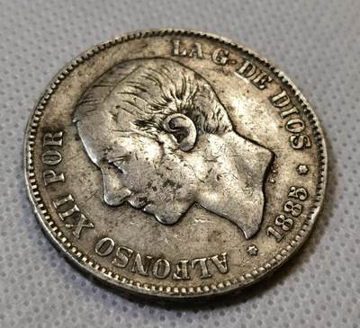 甄臻铺-世界币章拍卖（第44期）精品场拍品征集中，送拍享返佣金等优惠多多 好品相西班牙1885阿方索十二世五比塞塔银币，少见青年头像，背面带靛蓝包浆，很漂亮的状态，光银价就315元了，后市行情见长，这枚好品值得入手，细节见图