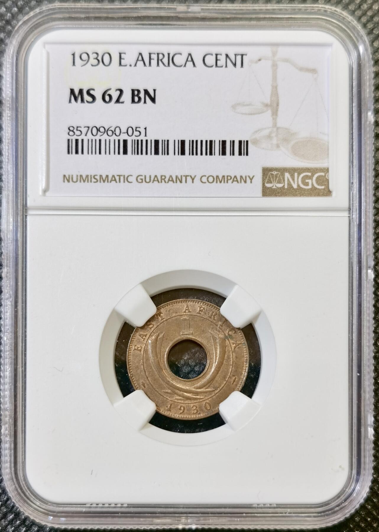 甄臻铺-世界币章拍卖（第44期）精品场拍品征集中，送拍享返佣金等优惠多多 NGC-MS62BN 英属东非中孔一分，有趣的中孔币，铜光满溢，状态非常好，经典殖民地品种