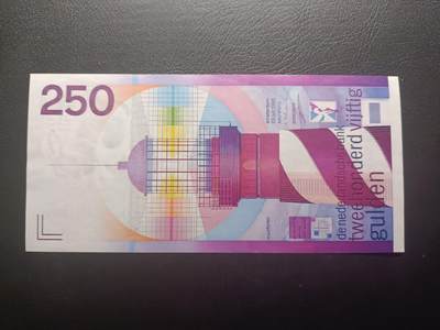 2025十二月第四期，总209期 - 荷兰1985版250盾UNC-，经典设计的荷兰盾三剑客里最难收集的最高面值，因价值巨大发行量少也难得一见，全票以灯塔为主题，正面巧妙运用了七色光光谱，背面是荷兰的海岸线，体现了航海文化对于国家的重要性，是荷兰盾收藏者追捧的经典品种之一