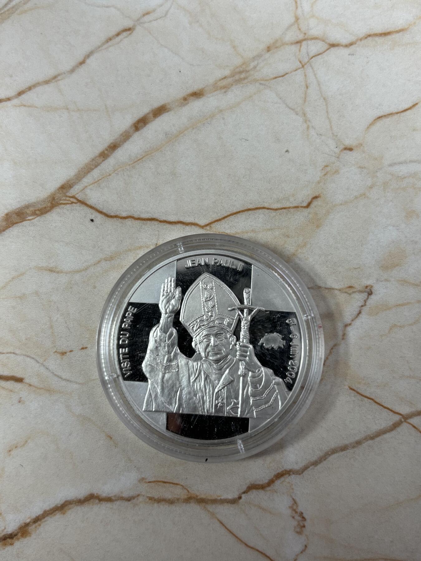 第185期拍卖 刚果2004年教皇访问瑞士纪念银币，925银，25克，银价346元