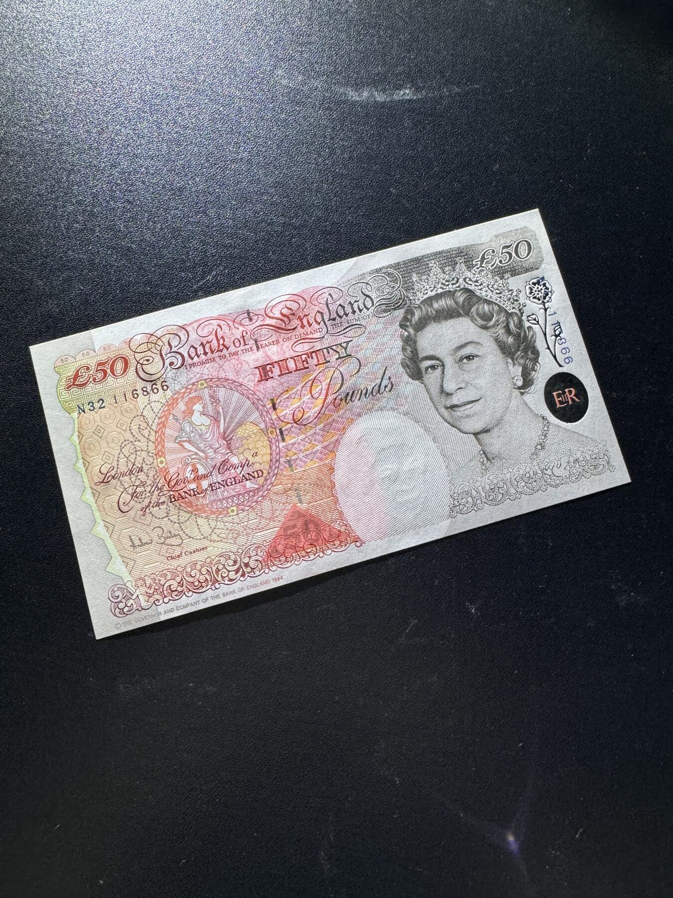 【外币出坑】0元0佣金起拍 无保留价 英国E序列 50磅 倒置号AU-Unc 如图